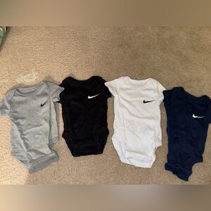 Set of 4 Nike 3 month baby onesies